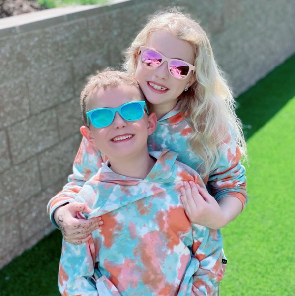 Navy blue flexible polarized kids sunglasses for ages 3-8 providing UV400 protection.
